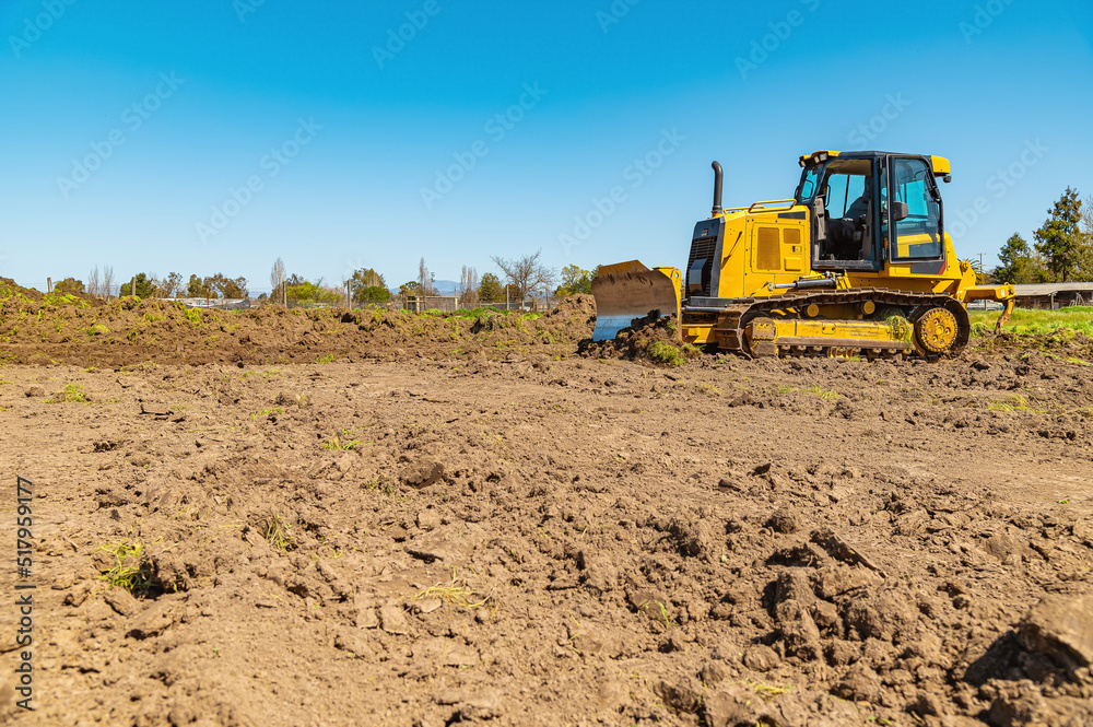 Dirt grading a new site for a house to be built on